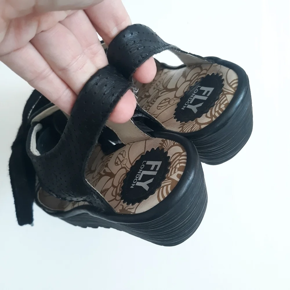 Fly London Ylfa Perforated Black Leather Wedge
